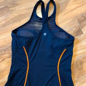 Titika tank. Built in bra with cups. Size 8